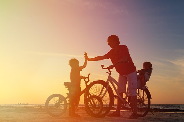Dad with kids on bike