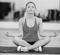 Woman meditating with iPhone