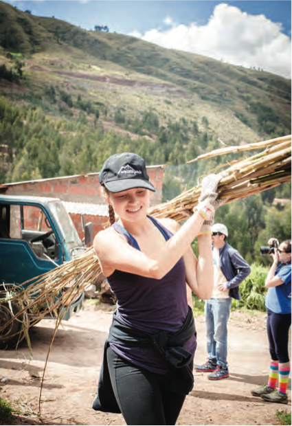 Wellfit Girls Shelly Westervelt Carries Bamboo for Roof