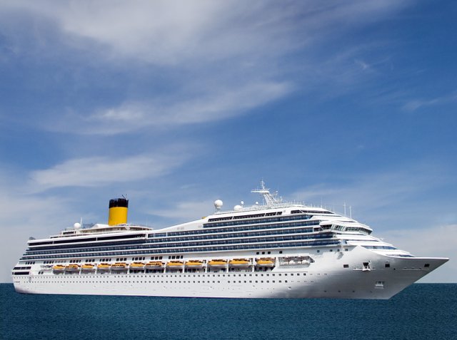 cruise ship against blue water and sky.jpg