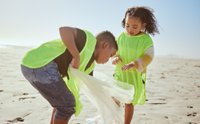 Kids volunteering on Earth day picking up trash on the beach.jpg