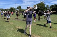 CCPS bands marching throught the heat.jpg