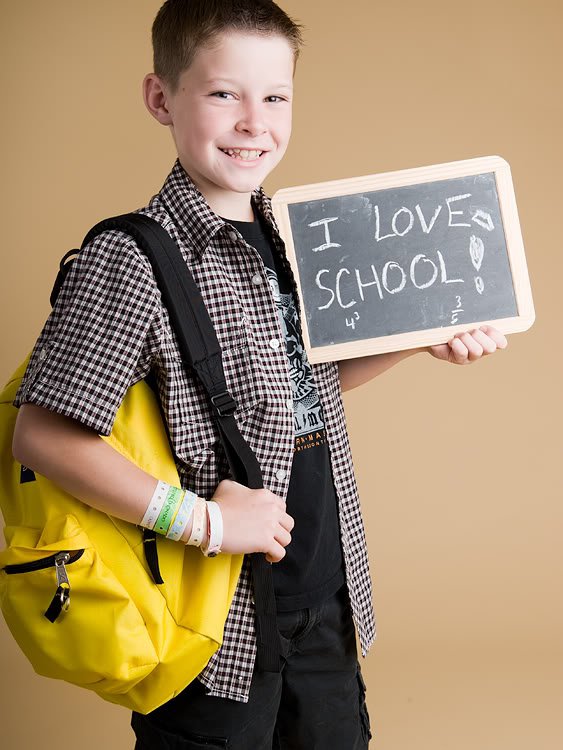 boy holding chalkboard