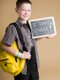 boy holding chalkboard