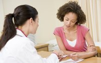 doctor talking to female patient